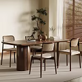 Wooden Dining Table With Woven Backrest Chairs Vase Books Potted Plant And Window Blinds