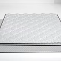 Supportive Quilted Mattress With Diamond Pattern And White Surface In Bright Room