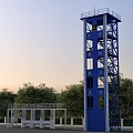 Industrial Training Tower With Blue Yellow Metal Structure Stairs Platforms And Surrounding Trees