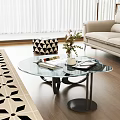 Modern Glass Coffee Table With Books Vase Plant And Sofa In Living Room