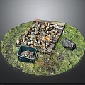 Outdoor Grass Area With Wooden Pallet Piled With Stones And Green Plastic Bin