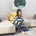 Woman Sitting on Carpet in Striped Sweater and Blue Pants Near Sofa with Pillows