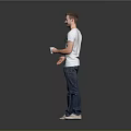 Man in Gray T-Shirt and Blue Jeans Holding White Cup Standing Against Simple Gray Background
