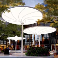 Vibrant Plaza Landscape Featuring White Canopies Seating Areas Green Trees And Pedestrians