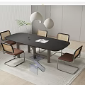Modern Dining Table Set With Rattan Back Chairs Black Tabletop And Green Plant Decor