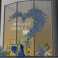 Heart Shaped Blue Floral Display In Front Of Glass Window With Green Chair And Bouquets