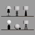 Various Modern Table Lamps Featuring Metal Bases And White Lampshades On Shelf