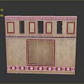 Scenic Landscape With Beige Structure Adorned in Red Featuring Rectangular Openings and Circular Base Decorations