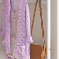 White Multi Tiered Clothes Rack Featuring Purple Cardigan Brown Bag Green Curtains And Decor