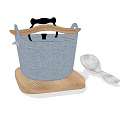 Stylish Blue Cooking Pot With Black Handle On Wooden Cutting Board And Silver Spoon