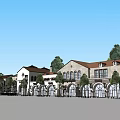 Mediterranean Style Commercial Street With Arched Windows Red Rooftops And Green Trees