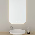 Modern Bathroom Mirror With LED Lighting Wall Mounted Above White Sink And Decorative Glass Vase