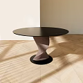 Modern Round Black Dining Table With Unique Twisted Base On Light Wooden Floor And Shadows