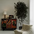 Colorful Patterned Entryway Side Cabinet With Tall Plant And Lamp Near Sofa
