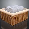 Woven Storage Basket With Beige Lining And Rolled Gray Towels