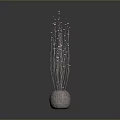 Tall Slender Decorative Plant With Pink Buds In Textured Gray Vase For Modern Interior