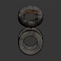 Three Stacked Tires With Dark Rusty Tread Pattern Against Gray Background