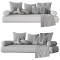 Stylish Gray and Blue Plush Pillows on Comfortable Sofa with Throw Blanket