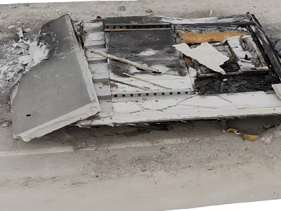 Burned Debris Of Damaged Item On Road Surface With Charred And Broken Parts 3d model