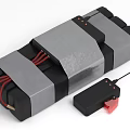 Homemade Wrapped Device With Red Wires And Black Remote Control Antenna