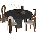Modern Round Black Dining Table Set With Varied Designed Chairs Vase And Small Bowl Decor