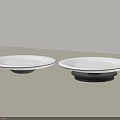 Two White Ceramic Dishes With Black Bases On Light Surface Minimalist Design