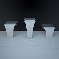 Garden Ornaments With Black Square Structures And Water Streams Falling Into Water Creating Ripples