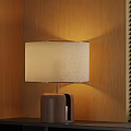 Table Lamp With Wooden Base And Beige Patterned Shade On Black Shelf Near Window Blinds