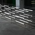 Multiple Modern White Pendant Lights Arranged On Metal Shelving For