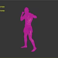 Shirtless Man Practicing Boxing Stance In Orange And Blue Shorts Against Gray Background