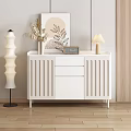 Modern White Sideboard With Vertical Slat Design Decorative Plants And Table Lamp