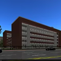 Red Brick Multi Storey School Building In Campus With Blue Sky Green Lawn And Pedestrians