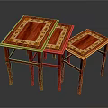 Three Red Wooden Nesting Stools With Golden Patterned Tops And Intricate Design