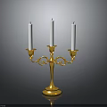 Gold Decorative Candelabra With Three White Candles On Black Surface