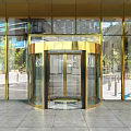 Golden Revolving Door At Modern Building Entrance With Glass Curtain Wall Design Exterior