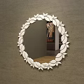 Round Decorative Mirror with White Leaf Frame Reflecting Bedroom Interior Wooden Floor Copper Lamp