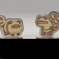 Cute Cartoon Ornament With Striped Tail And Base Displaying ORNAMENT Text