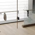 Golden Clothes Rack With Garment Black Bag Glass Shelf Vase White Blinds Light Wood Floor