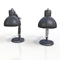 Two Stylish Black Minimalist Table Lamps On White Reflective Surface