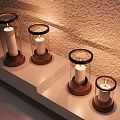 Decorative Ornament Set with Glass Covered Candle Holders Wooden Bases on Light Colored Shelf