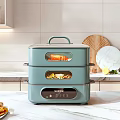 SUPOR Blue Green Three Tier Electric Food Steamer On Kitchen Countertop With Food Inside