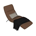 Modern Brown Lounge Chair with White Cushion Dark Blanket and Metal Legs
