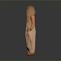 Blonde woman in light brown halter maxi dress with hands in pockets against gray background
