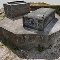 Weathered Concrete Structures With Square Openings Rusty Metal And Grassy Mossy Surroundings