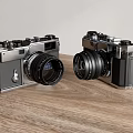 Vintage Digital Cameras With Classic Design Placed Side By Side On Wooden Table