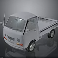 White Small Truck With Open Cargo Bed And Front Grille Design Features
