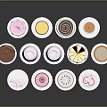 Assorted Colorful Decorated Small Cakes With Various Shapes And White Bases