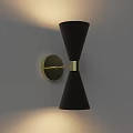 Modern Black Wall Light With Gold Metal Bracket And Illuminating Effect On Gray Wall