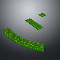Green Curved and Rectangular Circuit Boards Featuring Electronic Components and Patterns