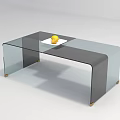 Modern Glass Coffee Table With Golden Legs And Yellow Fruit On White Plate